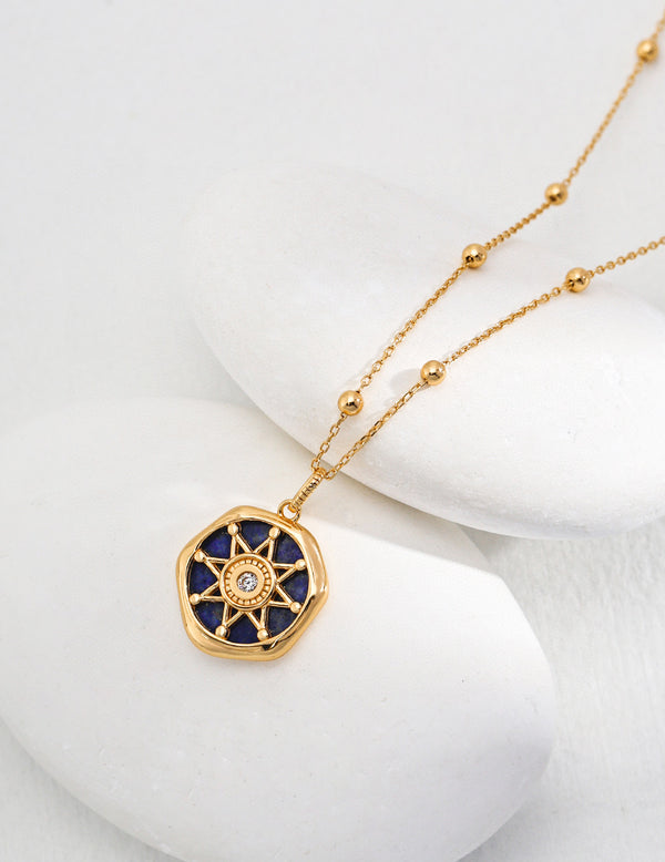 Stella Lapis Pendant Necklace in 18ct gold vermeil with a lapis lazuli centerpiece and cubic zirconia accents, featuring a vintage gold finish and adjustable chain.