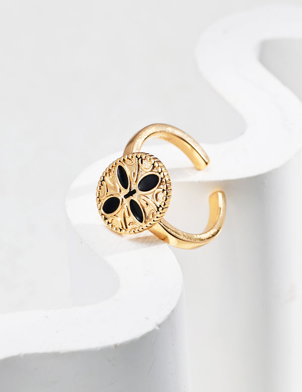 Golden Lotus Ring featuring 18ct gold vermeil and black enamel detailing, capturing vintage elegance with a timeless lotus design.
