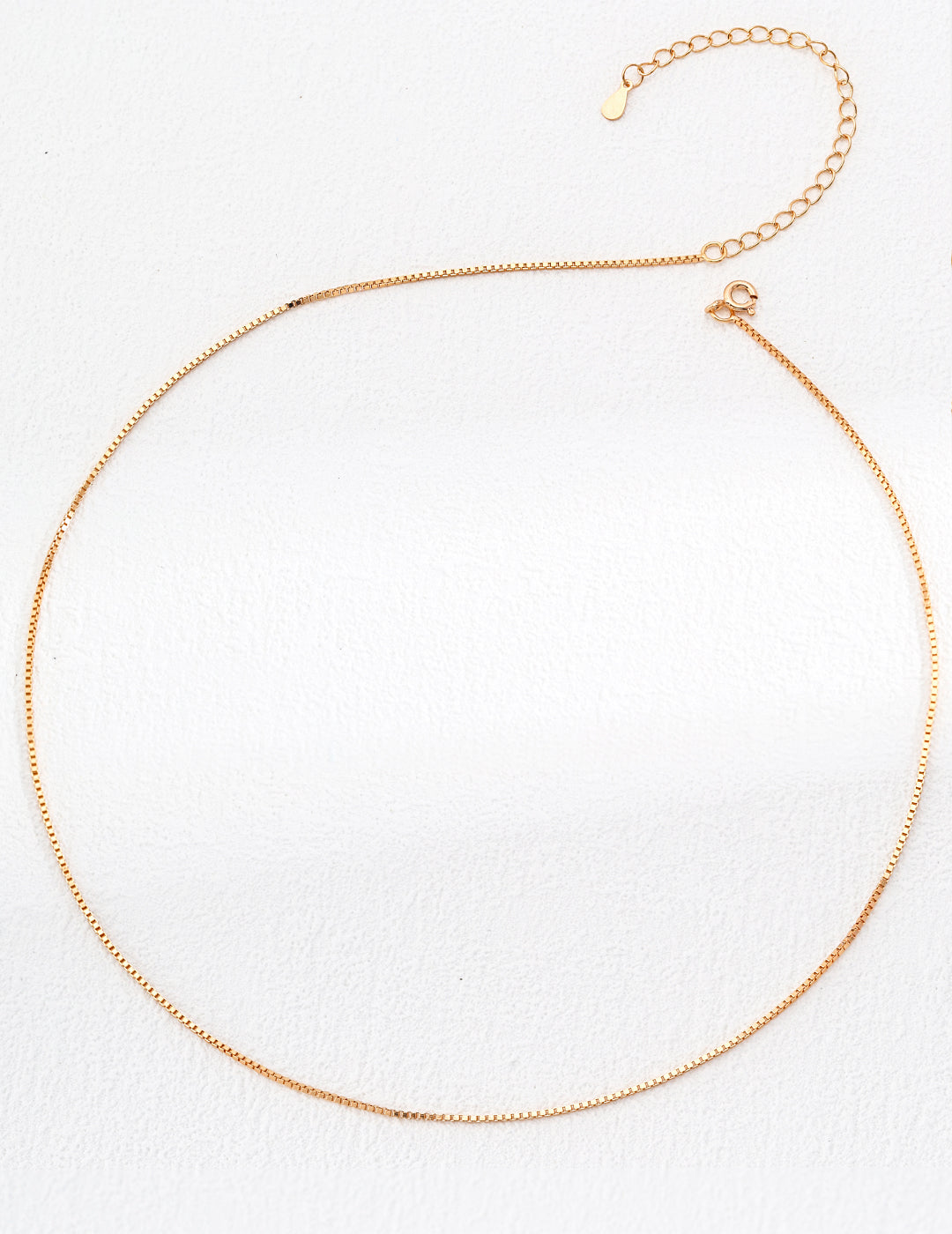 Golden Box Chain Necklace in 18ct gold vermeil, adjustable from 40cm to 46cm with a sleek 1mm width, perfect for layering or wearing alone.