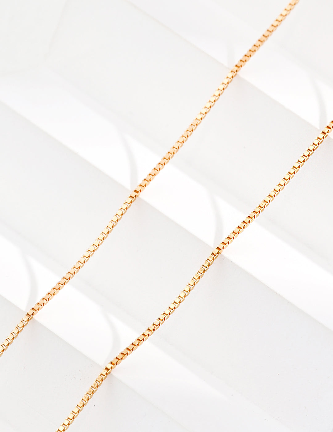 Golden Box Chain Necklace crafted in 18ct gold vermeil, featuring an adjustable length from 40cm to 46cm and a delicate 1mm width for versatile styling.